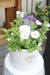 This easy DIY outdoor planter candle holder adds a pretty touch and a night-time glow to your summer patio or porch